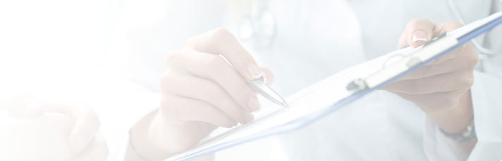 doctor writing on clipboard